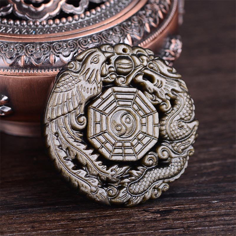 Golden Obsidian Pendant Necklace – Dragon Phoenix Bagua relief carving on wooden display, healing amulet