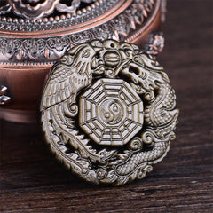 Golden Obsidian Pendant Necklace – Dragon Phoenix Bagua relief carving on wooden display, healing amulet