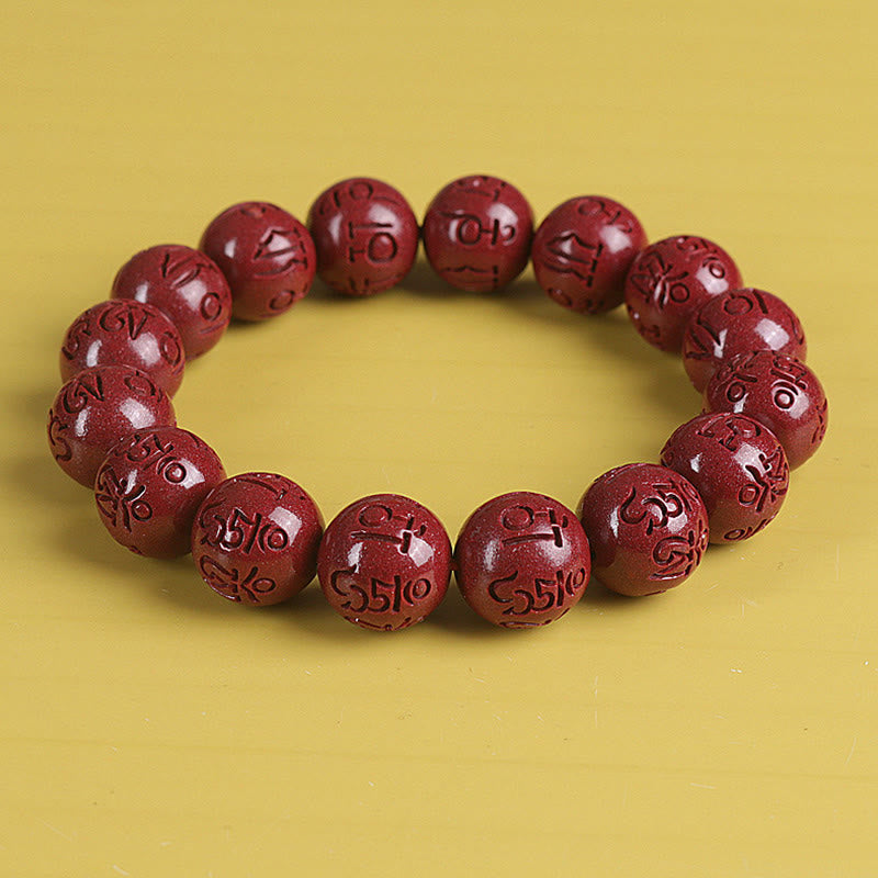 Double PiXiu Cinnabar Bracelet – Red engraved bead bracelet front view on yellow, mindfulness jewelry