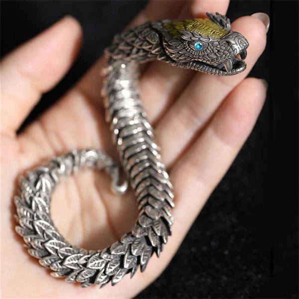 Dragon Snake Copper Bracelet – Fully articulated scale segments on hand against black, Mysterious