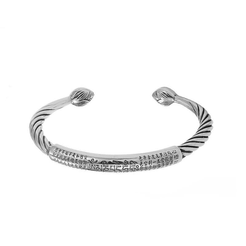 Tibetan Heart Sutra Cuff Bracelet – top-down on white, Heart Sutra Chinese text with wave motif separator
