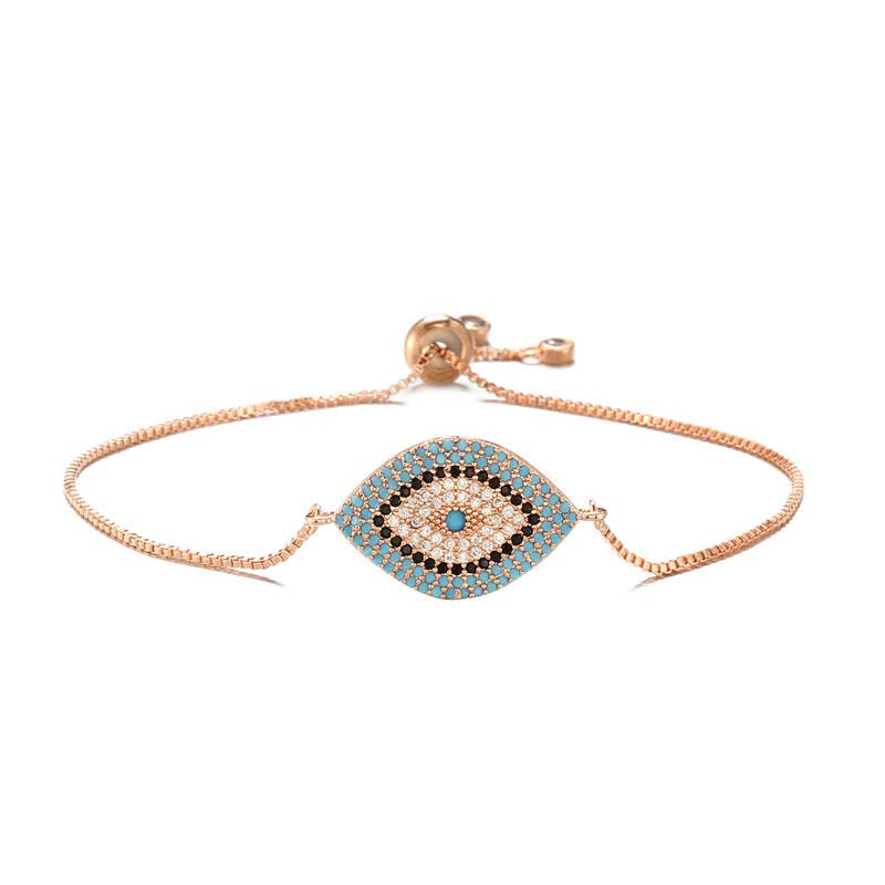 Evil Eye Healing Bracelet – Rose gold chain bracelet with turquoise evil eye on white, delicate design