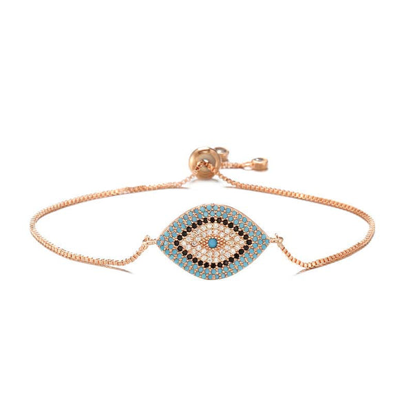 Evil Eye Healing Bracelet – Rose gold chain bracelet with turquoise evil eye on white, delicate design