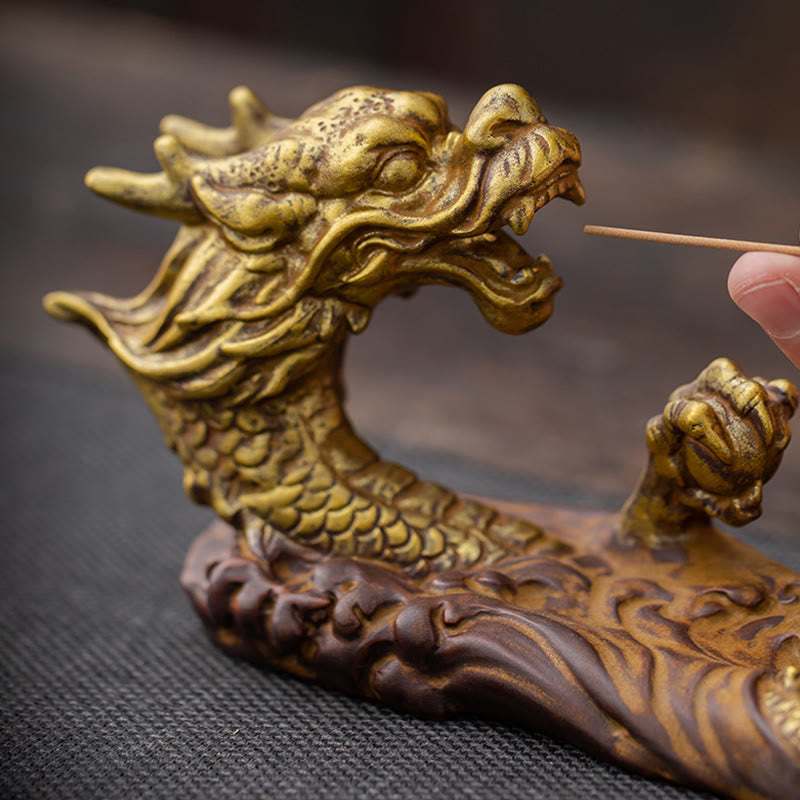 Dragon Protection Incense Burner – hand inserting incense into dragon mouth, dramatic close-up, ceremonial