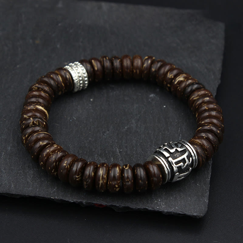 Om Mani Padme Hum Coconut Shell Bracelet – top-down on dark slate, organic bead bracelet