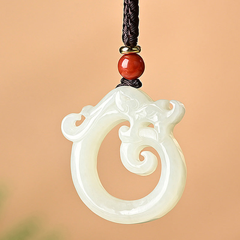White Jade Cyan Jade Dragon Pendant – white jade coiled chi dragon with red bead, serenity