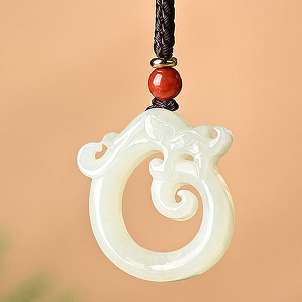 White Jade Cyan Jade Dragon Pendant – white jade coiled chi dragon with red bead, serenity
