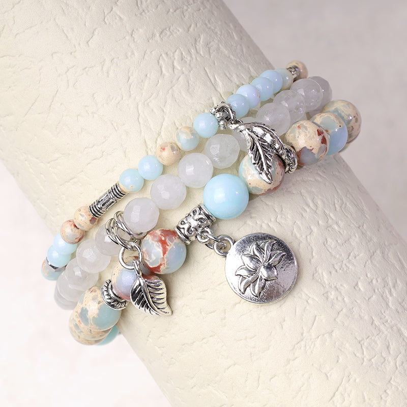 Natural Crystal Bracelet – blue jasper and white agate on wrist stand with silver lotus and leaf pendants, stacking jewelry