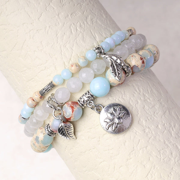 Natural Crystal Bracelet – blue jasper and white agate on wrist stand with silver lotus and leaf pendants, stacking jewelry