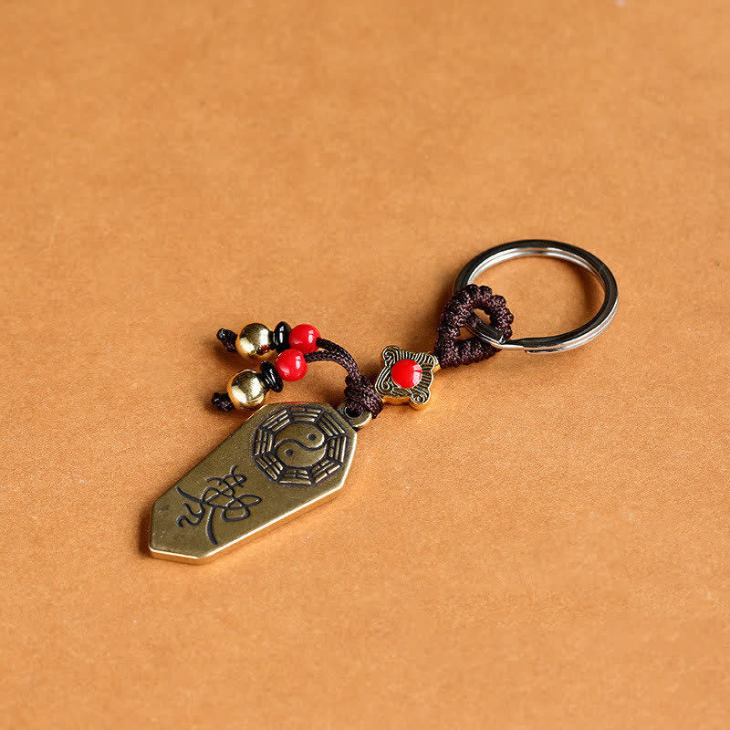 Feng Shui Bagua & Yin Yang Copper Keychain - Red beaded charms and bells draped on ceramic bowl, feng shui accessory