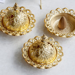 Tibetan Gold Mini Meditation Incense Burner – Three gold burners with stupa finials, lotus edges, cone visible inside