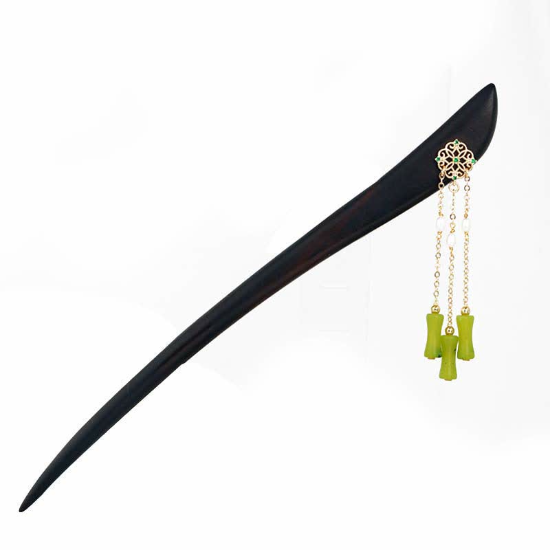 Peridot Ebony Wood Hairpin, black ebony hairpin with gold filigree and peridot tassel, white background