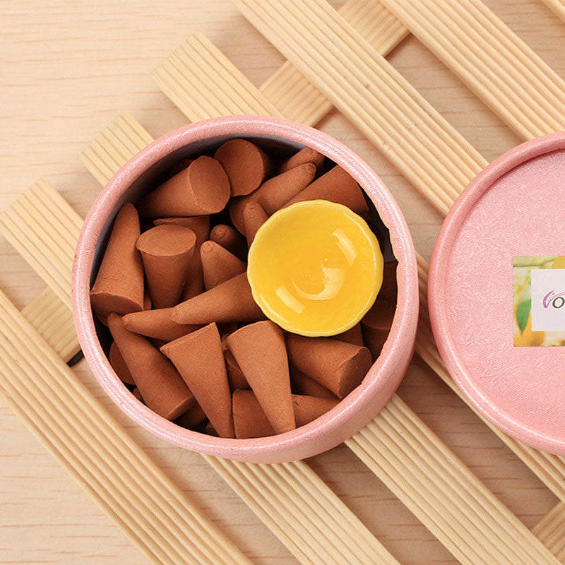 Tibetan incense cones – brown incense cones in pink tin with ceramic holder, relaxing