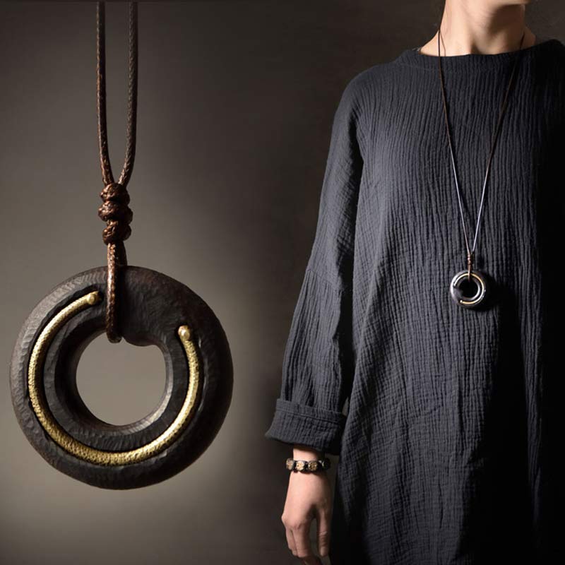 Large Wood Pendant Necklace - dark wood circle with gold inlay detail and lifestyle views, bohemian jewelry