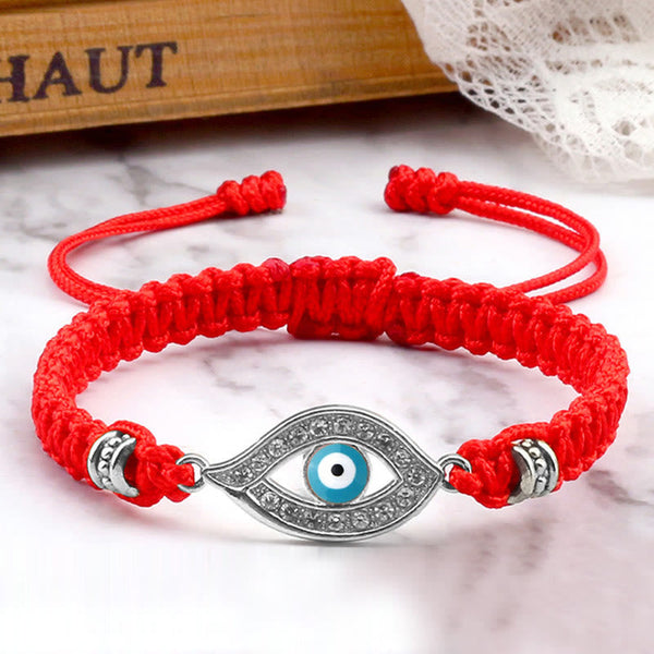 Red cord evil eye bracelet with silver blue evil eye crystal pave charm, marble photo