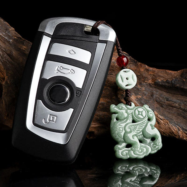 Jade Car Charm – Pale celadon jade pixiu on car key fob with wood grain background, prosperity keychain