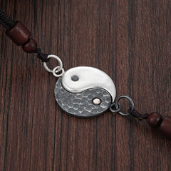 Sterling Silver Yin Yang Pendant - Hammered silver and oxidized yin-yang on black cord with wooden beads, yin yang bracelet
