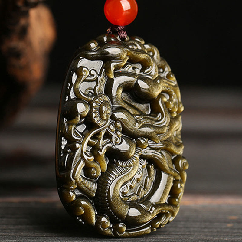 Gold Sheen Obsidian Dragon Pendant – Low angle view with iridescent golden flash and carnelian bead, rare