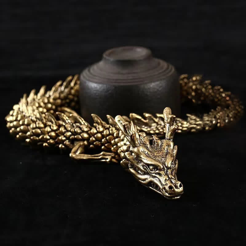 Brass Copper Dragon Statue – held in hand showing scale and poseable segmented body, Desk decor
