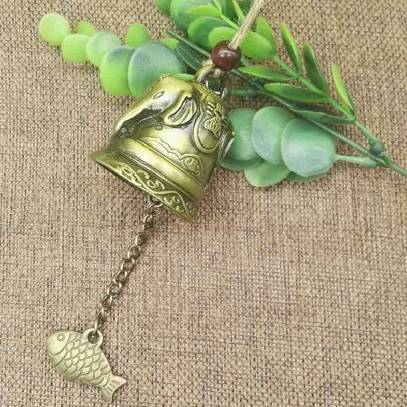 Feng Shui Wind Chime Bell - Overhead view of elephant head bell on burlap with succulent accents, auspicious
