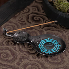 Gourd Yin Yang Bagua Incense Burner – Black gourd with turquoise Bagua and incense on fabric, copper burner
