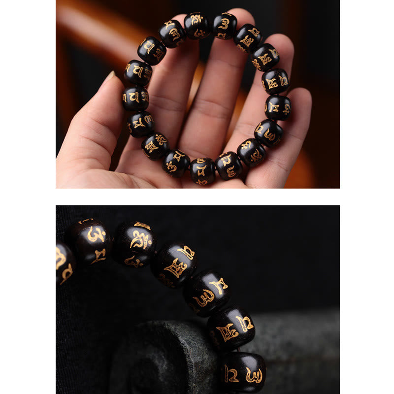Ebony Wood Om Mani Padme Hum Bracelet – Worn on palm with warm wood backdrop and macro detail, prayer bracelet