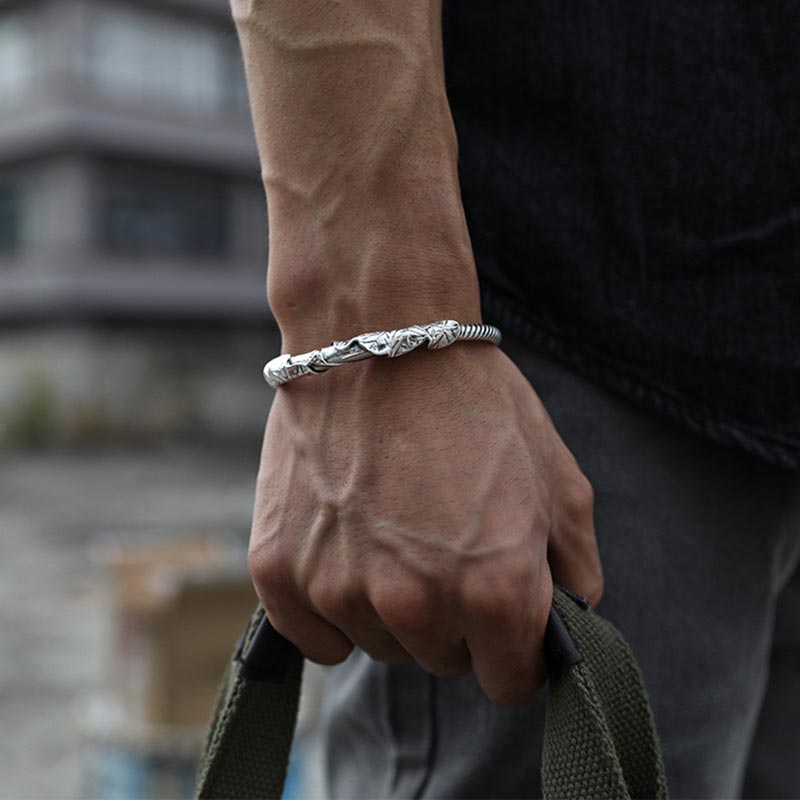 Tibetan Lotus White Copper Bracelet on wrist showing engraved detail, wealth and balance