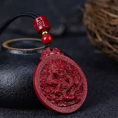 Cinnabar Dragon Pendant – Three-quarter view of carved dragon relief on vermillion amulet, Spiritual