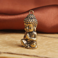 Copper Keychain Pendant – close-up Buddha face, spiritual charm
