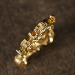 Mini Dragon Incense Burner – Gold geometric band ring with textured segments on dark wood, Artisan