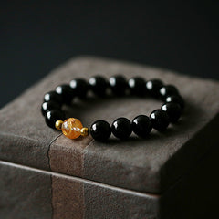Black Obsidian White Crystal Onyx Dragon Bracelet - Black beaded bracelet with golden amber center bead on suede, Strength