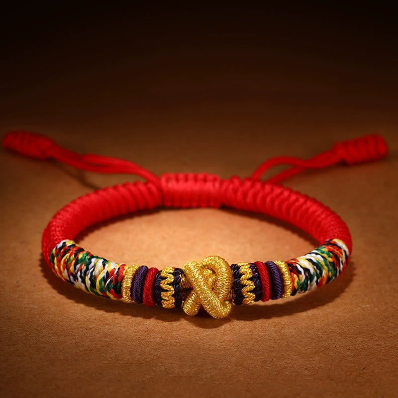 Tibetan Mantra Bracelet – Gold endless knot centerpiece with multicolored braided cord, adjustable jewelry