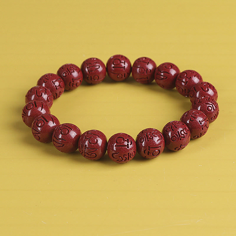 Double PiXiu Cinnabar Bracelet – Red cinnabar mantra bead bracelet front view on yellow, meditation bracelet