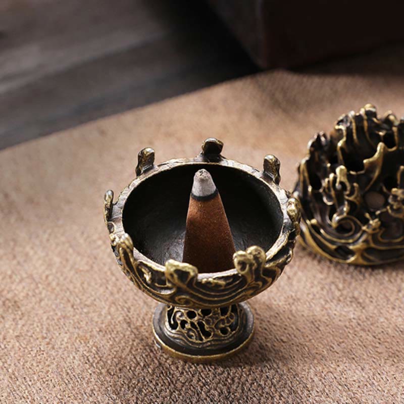 Mountain Incense Burner Open View – Lit cone inside bronze body with removable lotus lid beside, burlap fabric background