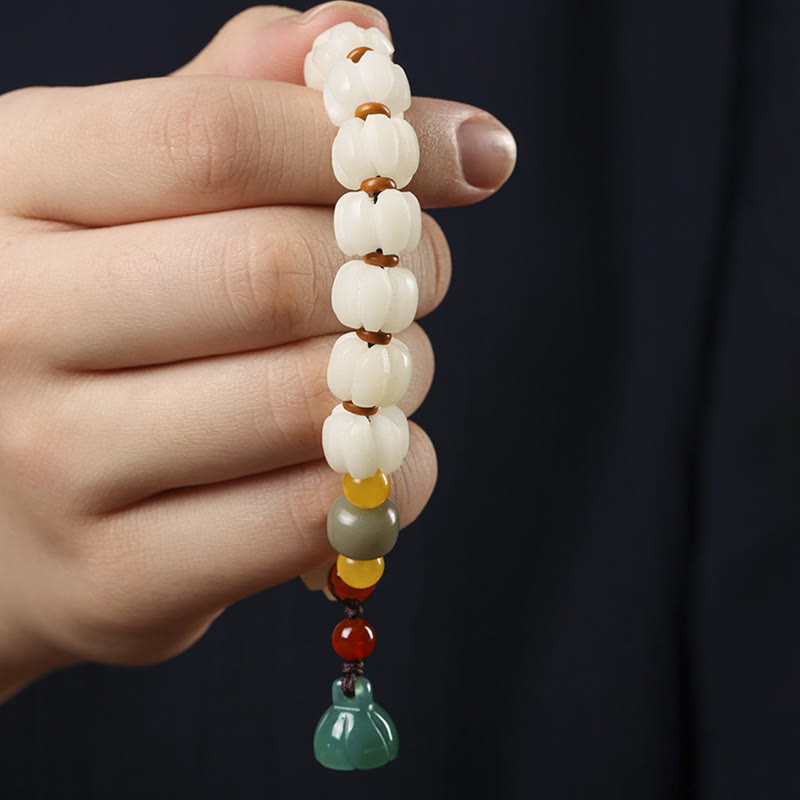 Bodhi Seed Lotus Bead Bracelet - held in hand, full bead strand with lotus charm