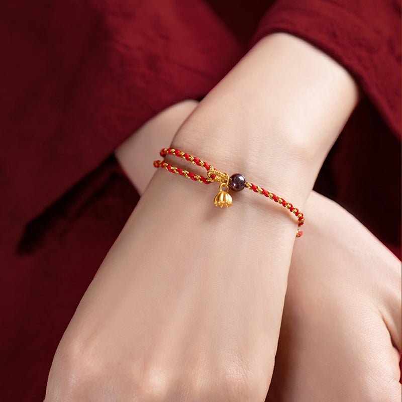 Red Gold Rope Lotus Braid Bracelet - crossed hands wrist shot with gold charm, red string bracelet