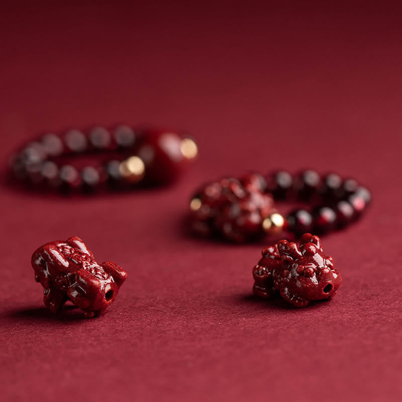 Garnet Cinnabar Ring – two red cinnabar PiXiu carvings detail burgundy surface, talisman craft