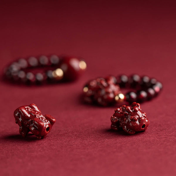 Garnet Cinnabar Ring – two red cinnabar PiXiu carvings detail burgundy surface, talisman craft