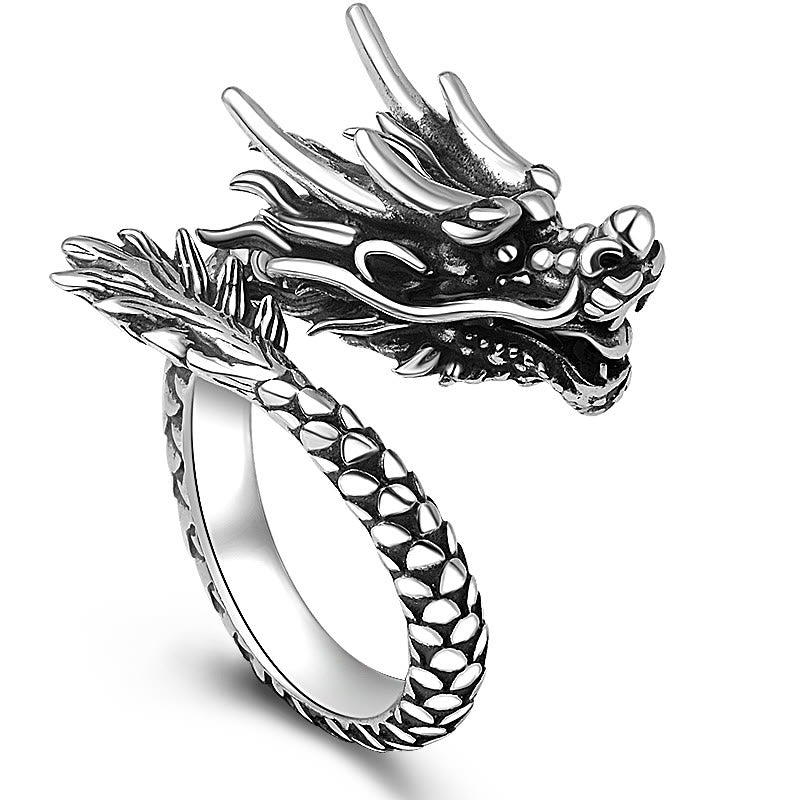 Sterling Silver Dragon Ring - three-quarter view of detailed dragon head with open jaw and fangs, bold statement