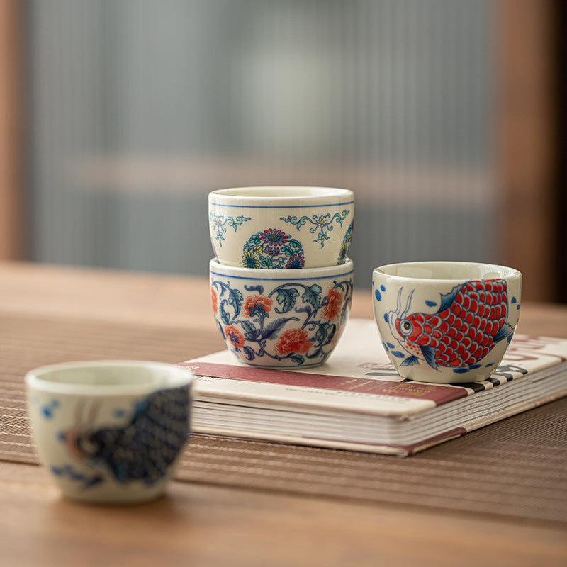 Koi Fish Sunflower Cup – angled top-down showing arowana and sunflower, teaware