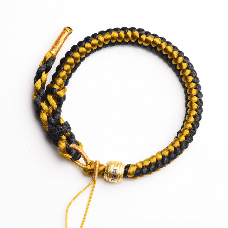 Tibetan Black Gold Dragon Scale Bracelet – white background catalog shot, adjustable sliding knot, gold mantra bead