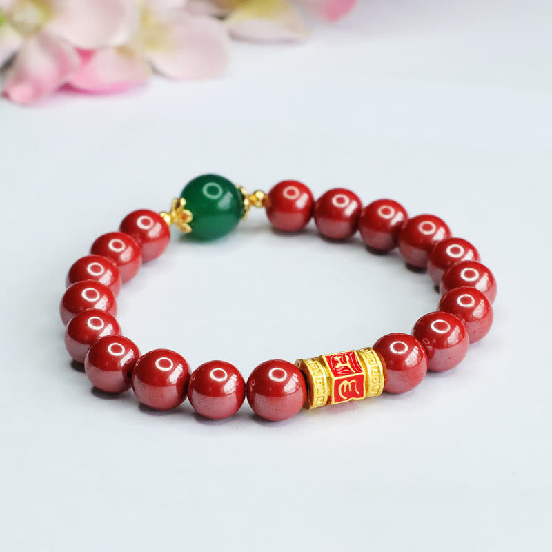 Cinnabar Agate Bracelet – Shallow focus on white with flowers, red and green beads