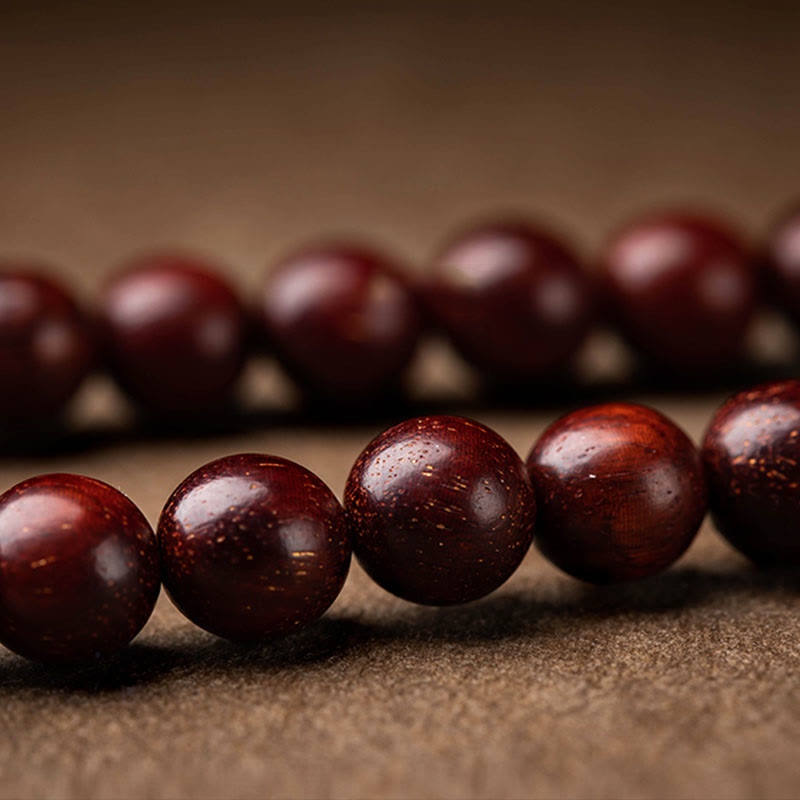 Red Sandalwood Car Hanging – Close-up of red silk mystic knot with white jade bead and dark wooden spacers, Chinese knotwork