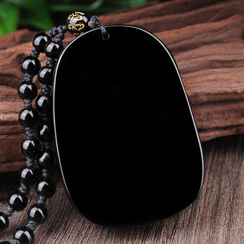 Black Obsidian Dragon Pendant – Smooth polished pendant with mantra bead on natural wood, fulfilment