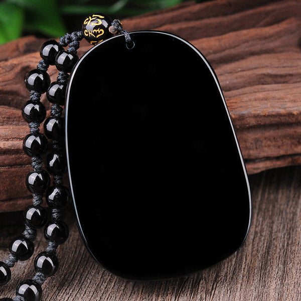 Black Obsidian Dragon Pendant – Smooth polished pendant with mantra bead on natural wood, fulfilment