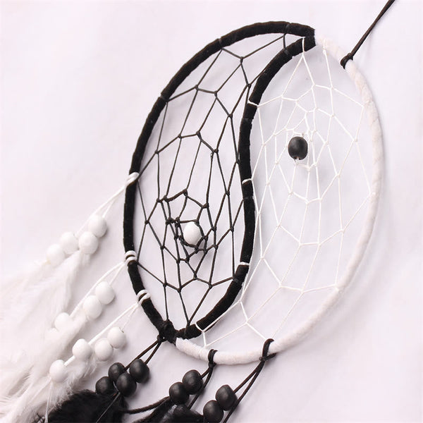 Yin Yang Dream Catcher with Feathers – Diagonal close-up yin-yang web with beads, wall art