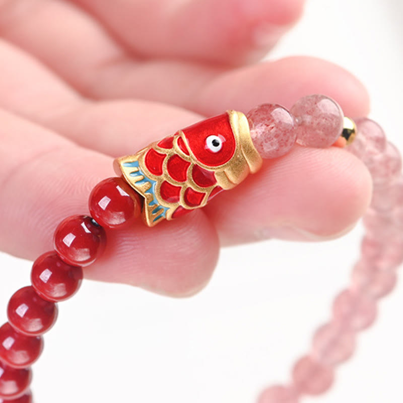 Strawberry Quartz Koi Bracelet – detail of elastic cord threading through each bead hole