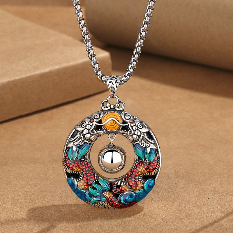 Double Dragon Copper Necklace – Red scaled twin dragons with blue waves, movable bell on box chain, kraft styling