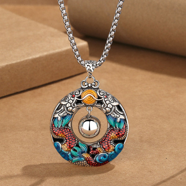 Double Dragon Copper Necklace – Red scaled twin dragons with blue waves, movable bell on box chain, kraft styling