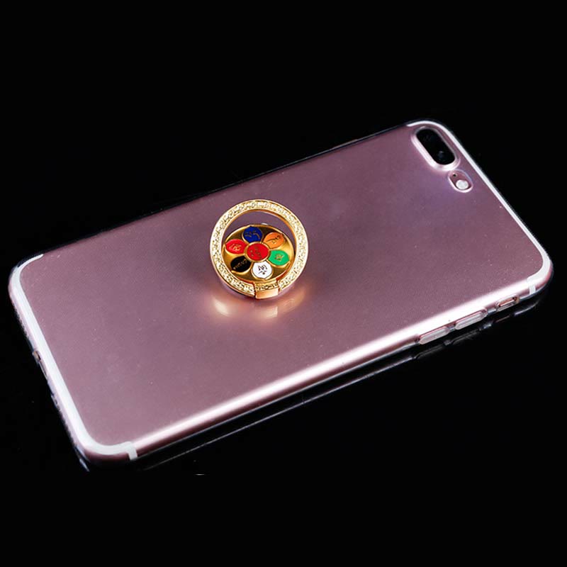 Om Mani Padme Hum Phone Ring Holder – Gold mantra ring on rose gold iPhone in clear case, phone grip